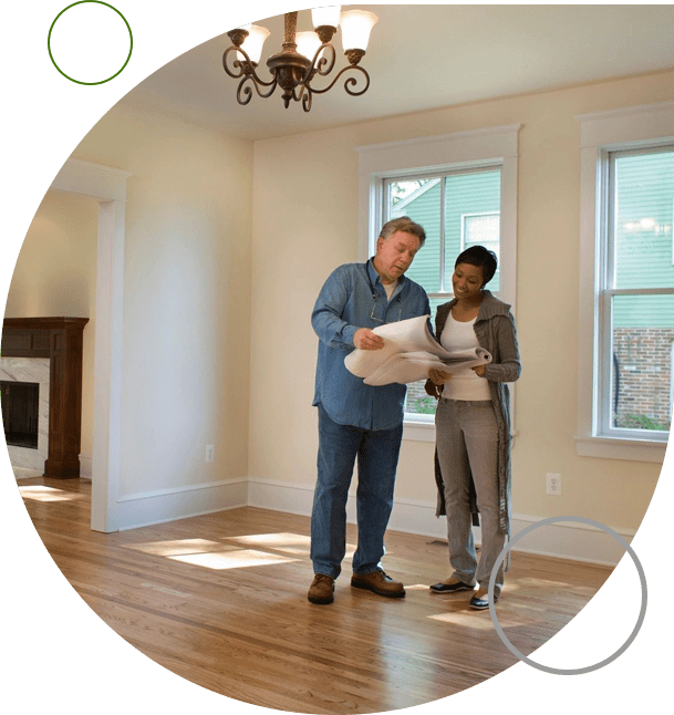 A man and woman standing in the middle of a room.